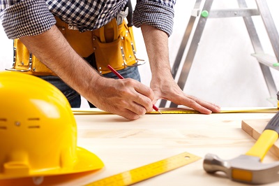 Man at construction Site with Plans